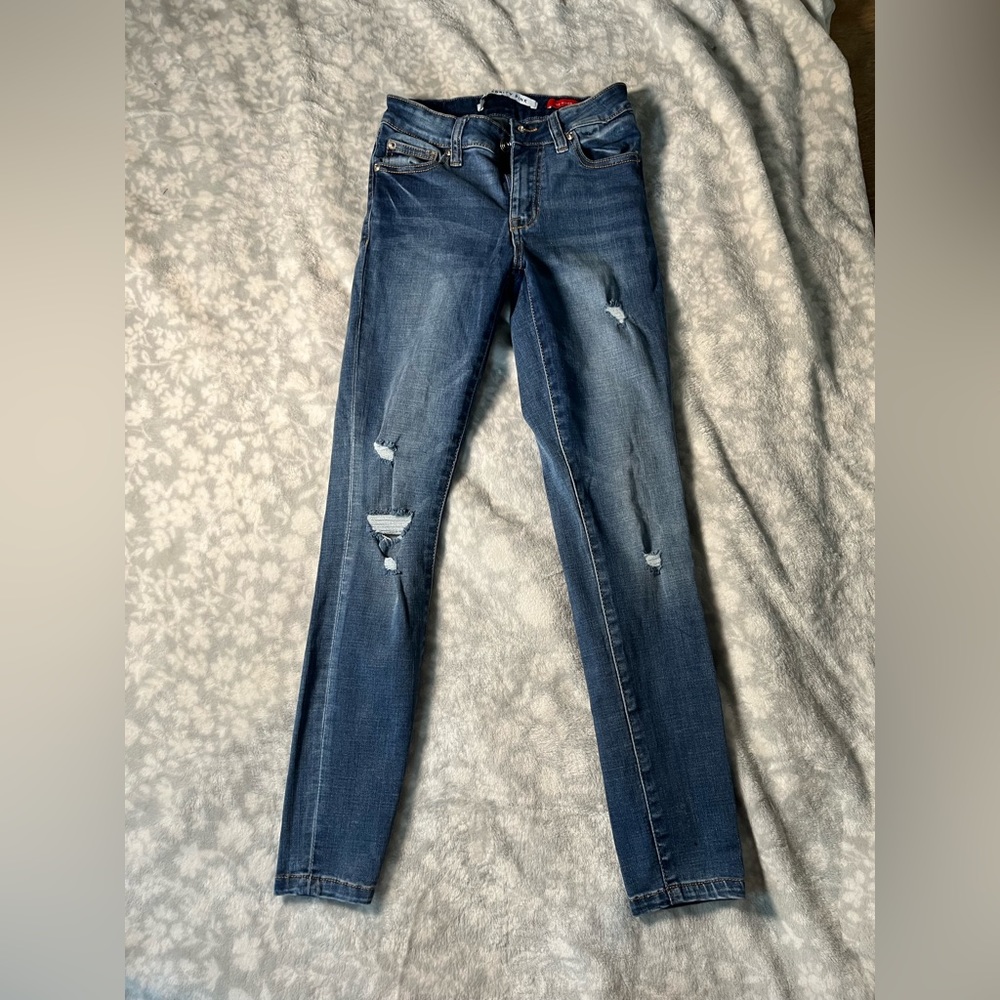 Teens blue jeans ripped
